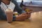 Mid section of man with milkshake glass using phone