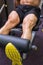 Mid section of muscular man doing a leg workout