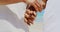 Mid section of romantic active senior African American couple holding hands on the beach 4k