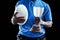 Mid section of sportsman holding trophy and rugby ball