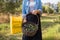 Mid section of woman holding harvested olives in basket