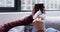 Mid section of woman wiping her smartphone with a tissue