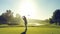 A Mid-Swing Golfer Silhouette Against a Vibrant Green Golf Course Under a Clear Blue Sky