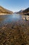 Midday Autumn landscape calm river in the Caucasus Mountains with rocks in the near term