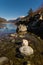 Midday Autumn landscape calm river in the Caucasus Mountains with rocks in the near term