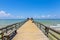 Midday at Naples pier on beach Golf