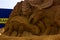Middelkerke, Belgium - 23 July 2022: An ankylosaurus and  triceratops dinosaur sand sculpture in Middelkerke, Belgium. The