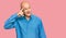 Middle age bald man wearing casual clothes smiling pointing to head with one finger, great idea or thought, good memory