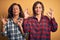 Middle age beautiful couple of sisters wearing casual shirt over isolated yellow background relax and smiling with eyes closed