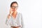 Middle age businesswoman wearing striped dress and glasses over isolated white background mouth and lips shut as zip with fingers