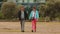 Middle age couple walking by the hand, spending time together, family travel