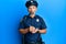Middle age handsome man wearing police uniform writing traffic fine making fish face with mouth and squinting eyes, crazy and