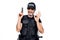 Middle age handsome policeman wearing police uniform and bulletproof vest holding gun doing ok sign with fingers, smiling friendly
