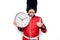 Middle age handsome wales guard man wearing traditional uniform holding big clock smiling happy and positive, thumb up doing