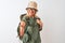 Middle age hiker woman wearing backpack hat canteen glasses over isolated white background smiling friendly offering handshake as