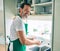 Middle age man with beard smiling happy washing dishes at home