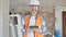 Middle age man builder smiling confident using touchpad at construction site