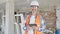 Middle age man builder smiling confident using touchpad at construction site
