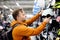 Middle age man choosing bicycle helmet in sport store