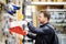 Middle age man choosing the right tool box in a hardware store