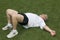 Middle age man stretching sports field