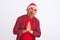 Middle age man wearing Christmas Santa hat standing over isolated white background begging and praying with hands together with