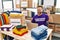 Middle age man wearing volunteer t shirt working with laptop showing and pointing up with fingers number three while smiling