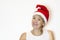 Middle age senior  adult woman in a Santa hat for New Year and Christmas