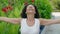 Middle age woman breathing with closed eyes at park