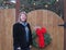 Middle Age Woman Portrait Near Christmas Wreath Fence