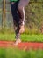 Middle age woman stretching knees and ankles, she jumping bare feet