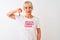 Middle age woman wearing fanny t-shirt with irony comments over isolated white background with angry face, negative sign showing