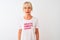 Middle age woman wearing fanny t-shirt with irony comments over isolated white background with a confident expression on smart