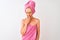 Middle age woman wearing shower towel after bath standing over  white background bored yawning tired covering mouth with