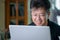 Middle-aged Asian man working at home. Telecommuting concept