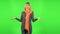 Middle aged blonde woman is indignantly talking to someone. Green screen