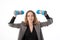 A middle-aged business woman in a jacket holds dumbbells. Workout, physical activity for the busy concept. Isolated on a white