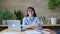 Middle-aged business woman office worker, manager looking at camera sitting at desk