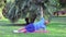 Middle-aged caucasian man doing a plank exercise in public park outdoors