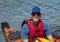 Middle-aged Caucasian man ready for a kayaking adventure in the Atlantic Ocean at Bar Harbor, Maine.