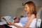 Middle Aged Couple In Bed Together With Woman Reading Book