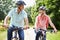 Middle Aged Couple Enjoying Country Cycle Ride Together