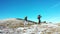 Middle-aged couple go hiking in the alpine winter mountains.