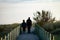 Middle-Aged Couple Walks on Boardwalk