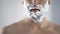 Middle-aged male disappointed and angry because of quality of new shaving foam