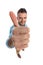 Middle aged man with chino pants smiling and making thumbs up gesture