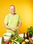 Middle-aged man cook fresh salad