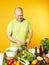 Middle-aged man cook fresh salad