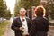 A middle-aged man gives a rose to a woman, romantic date