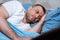 Middle-Aged Man Having Insomnia Lying In Bed At Home